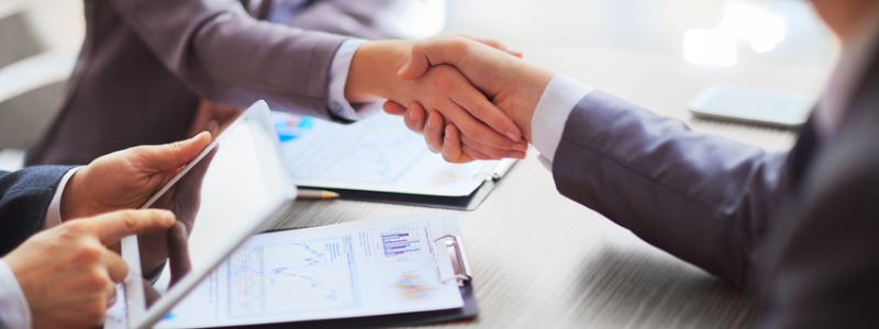 Business people shaking hands, finishing up a meeting